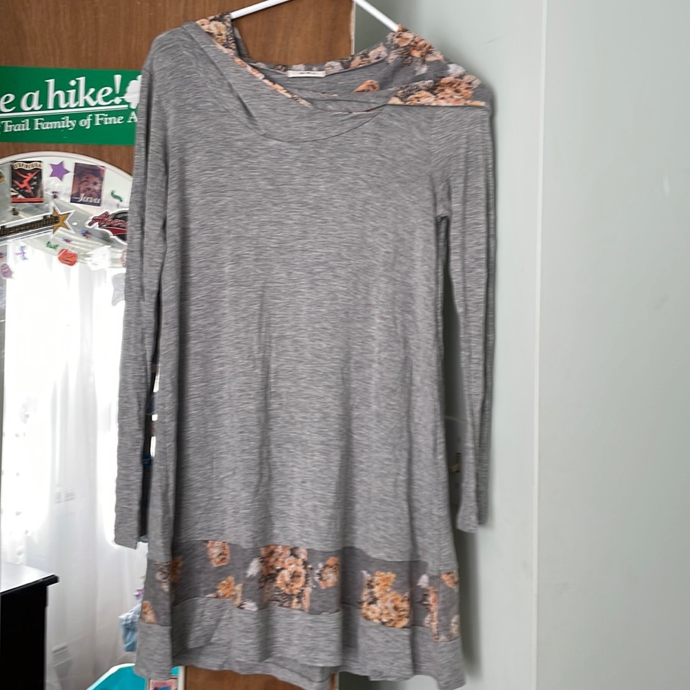 Grey dress with flower hood .
